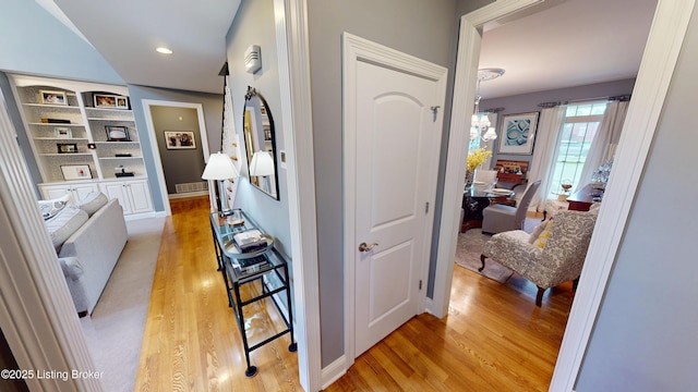 103 Morgan Ct, Bardstown, KY 40004 - corridor featuring light wood-style floors, a chandelier, baseboards, and built in features