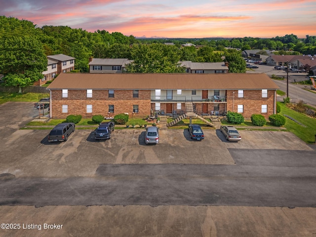 623 Westport Rd, Elizabethtown, KY 42701 - view of front of home with uncovered parking, brick siding, and metal roof