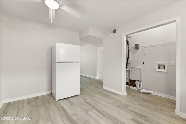 623 Westport Rd, Elizabethtown, KY 42701 - unfurnished living room with light wood finished floors, a ceiling fan, and baseboards