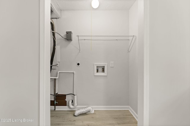623 Westport Rd, Elizabethtown, KY 42701 - laundry room with wood finished floors, electric dryer hookup, hookup for a washing machine, baseboards, and a textured ceiling