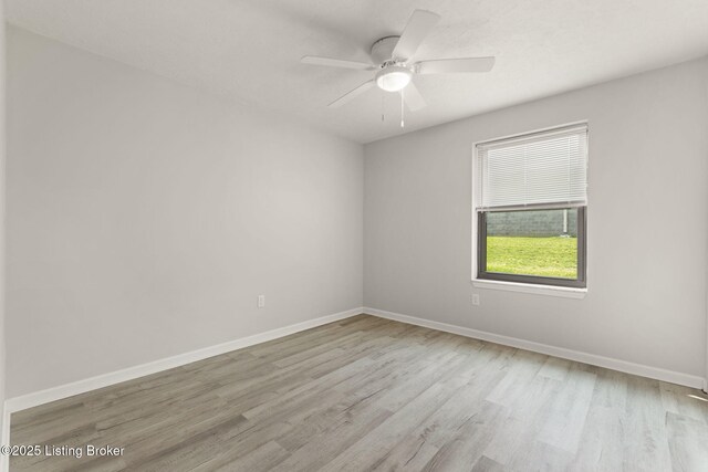 623 Westport Rd, Elizabethtown, KY 42701 - empty room with wood finished floors, baseboards, and a ceiling fan