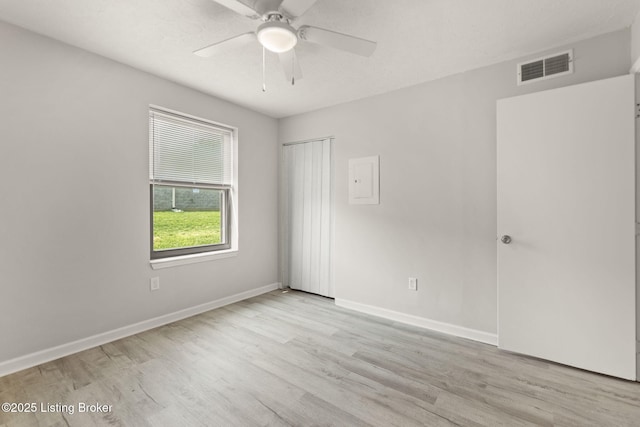 623 Westport Rd, Elizabethtown, KY 42701 - unfurnished room with wood finished floors, a ceiling fan, and baseboards