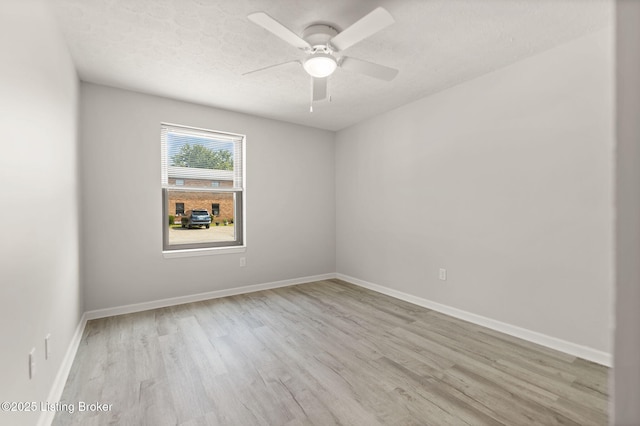 623 Westport Rd, Elizabethtown, KY 42701 - spare room with wood finished floors, ceiling fan, a textured ceiling, and baseboards