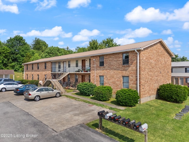 623 Westport Rd, Elizabethtown, KY 42701 - view of building exterior with uncovered parking and stairway