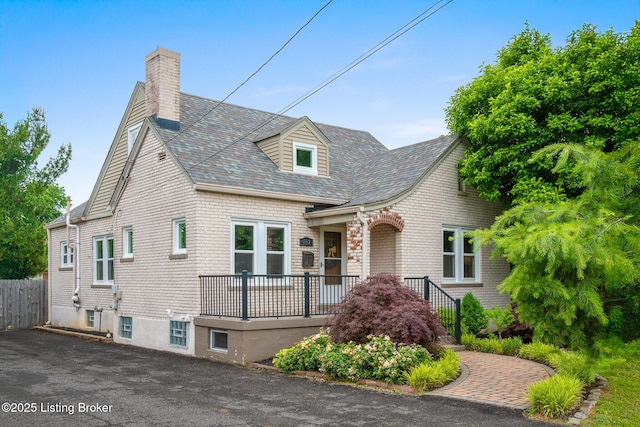 857 Melford Ave, Louisville, KY 40217 - view of front facade with a chimney and a shingled roof