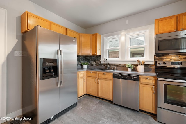 857 Melford Ave, Louisville, KY 40217 - kitchen with stainless steel appliances, a sink, and backsplash