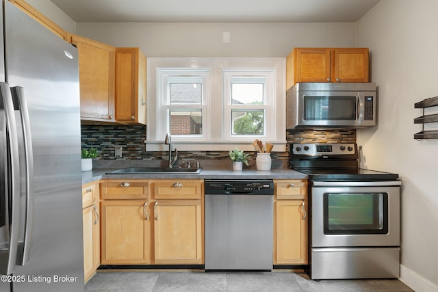 857 Melford Ave, Louisville, KY 40217 - kitchen featuring stainless steel appliances, a sink, and tasteful backsplash