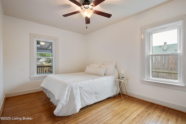 857 Melford Ave, Louisville, KY 40217 - bedroom with baseboards, wood-type flooring, and a ceiling fan