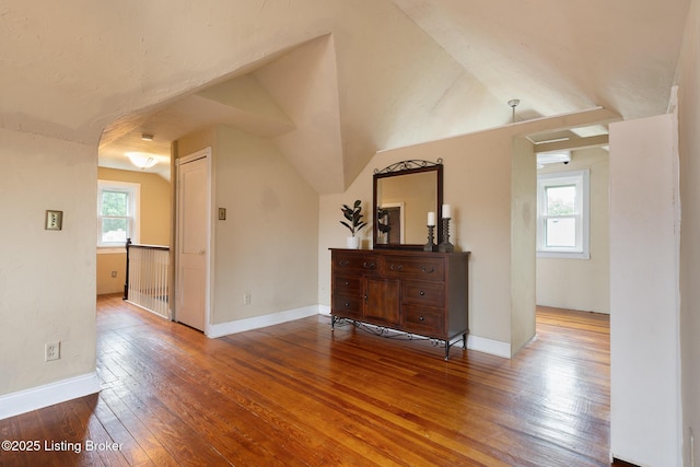 857 Melford Ave, Louisville, KY 40217 - spare room featuring wood-type flooring, baseboards, and lofted ceiling