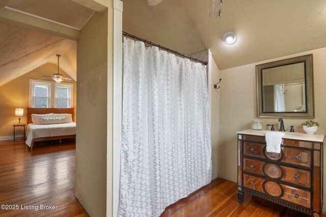 857 Melford Ave, Louisville, KY 40217 - bathroom with lofted ceiling, hardwood / wood-style floors, ceiling fan, vanity, and ensuite bath