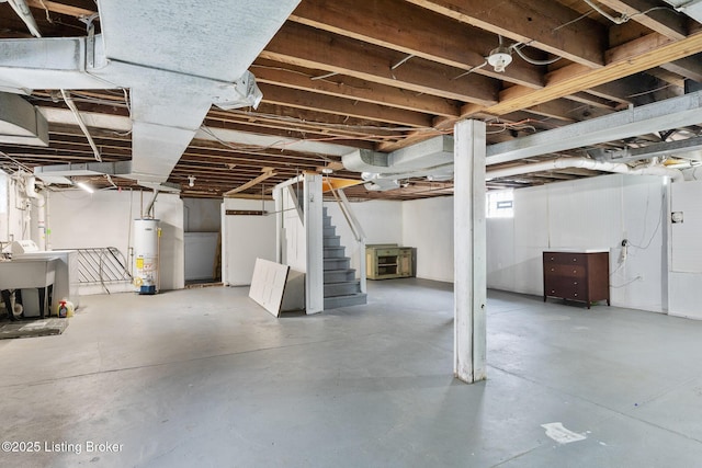 857 Melford Ave, Louisville, KY 40217 - below grade area featuring gas water heater and stairs