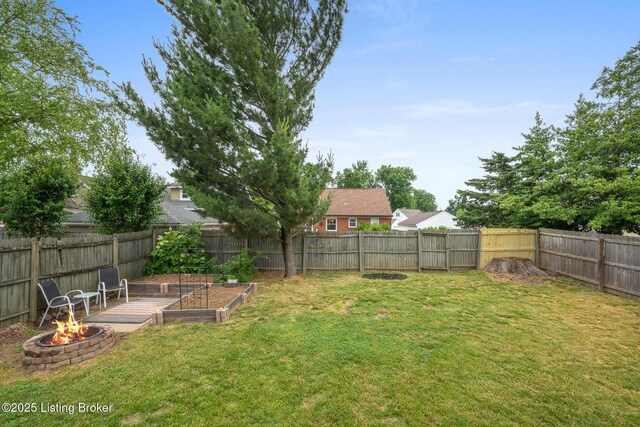 857 Melford Ave, Louisville, KY 40217 - view of yard with an outdoor fire pit and a vegetable garden