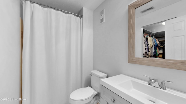 208 Forest Park Rd, Louisville, KY 40223 - bathroom featuring toilet, vanity, a walk in closet, and curtained shower