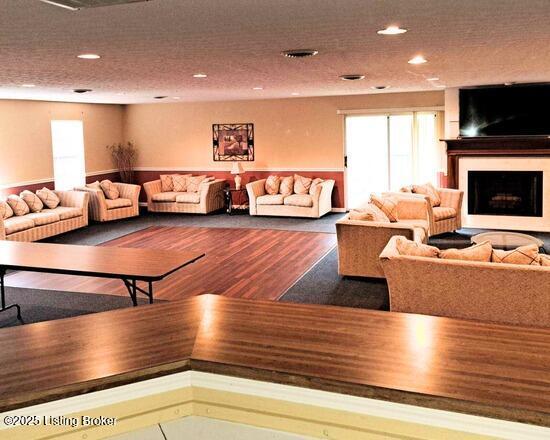 208 Forest Park Rd, Louisville, KY 40223 - living area featuring wood finished floors, recessed lighting, and a fireplace