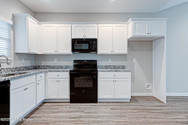 LOT14 Deer Vista Dr, Louisville, KY 40291 - kitchen with black appliances, a sink, light stone counters, white cabinetry, and light wood-style floors