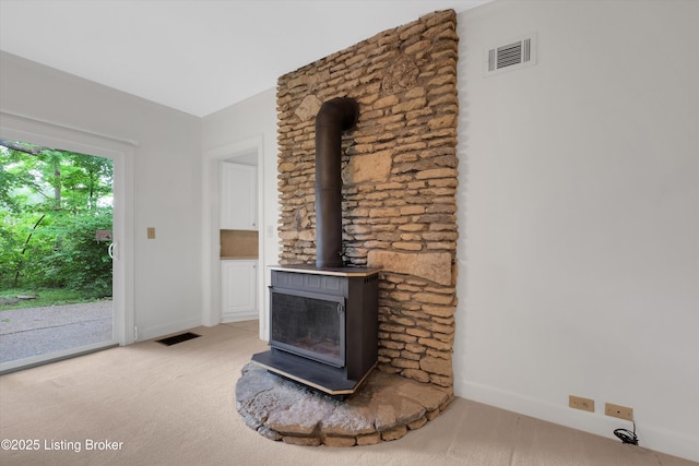5212 Mary Clayton Ln, Crestwood, KY 40014 - unfurnished living room with a wood stove and light colored carpet