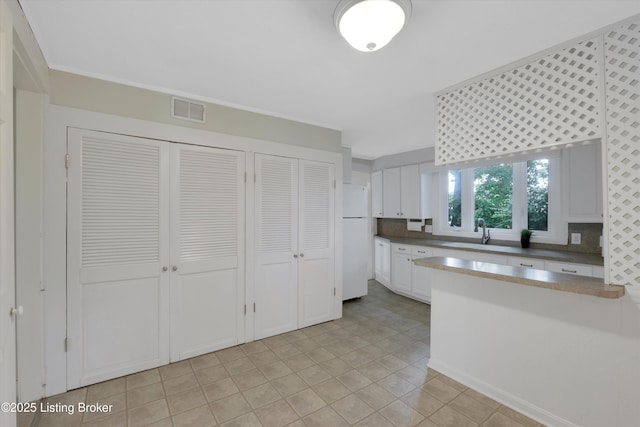 5212 Mary Clayton Ln, Crestwood, KY 40014 - kitchen featuring freestanding refrigerator, white cabinetry, and dark countertops