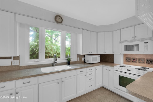 5212 Mary Clayton Ln, Crestwood, KY 40014 - kitchen with white appliances, white cabinetry, light tile patterned flooring, decorative backsplash, and light countertops