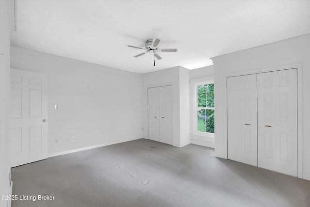 5212 Mary Clayton Ln, Crestwood, KY 40014 - unfurnished bedroom featuring multiple closets, ceiling fan, and concrete floors