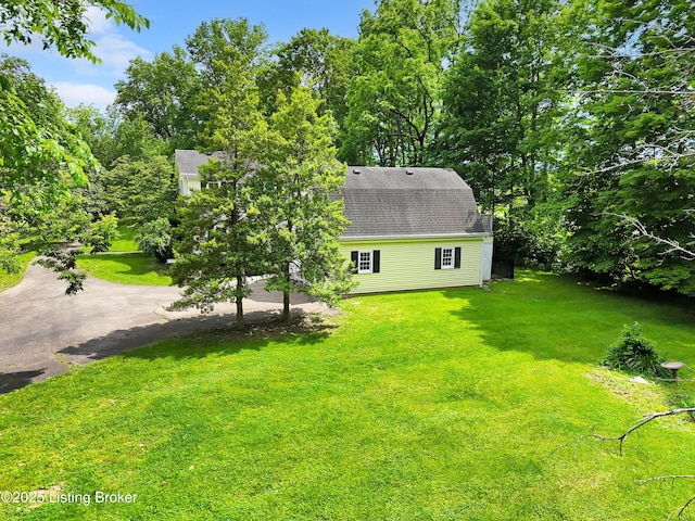 5212 Mary Clayton Ln, Crestwood, KY 40014 - view of property exterior with a yard, a shingled roof, and view of scattered trees