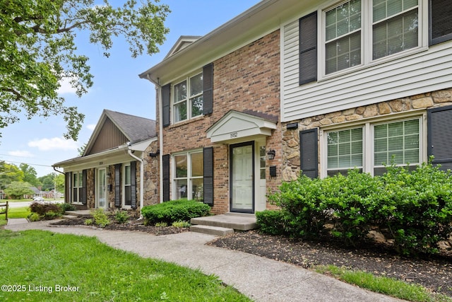1932 Manor House Dr, Louisville, KY 40220 - view of front facade featuring stone siding and brick siding