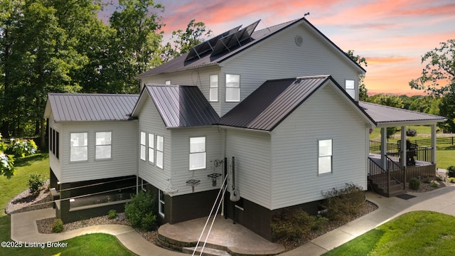 684 Cheslon Rd, Munfordville, KY 42765 - back of property featuring metal roof and a lawn
