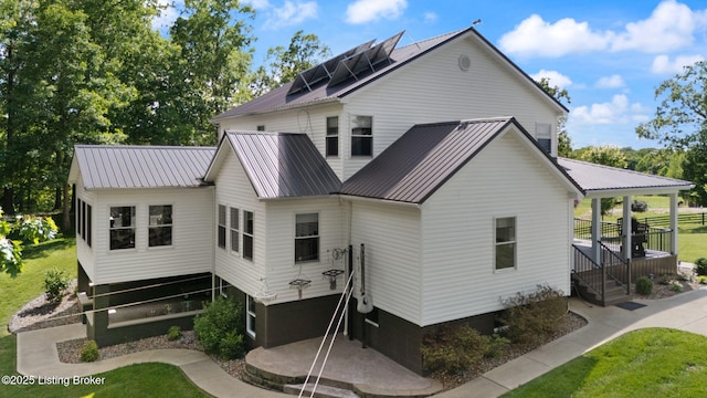 684 Cheslon Rd, Munfordville, KY 42765 - back of house with metal roof and a yard