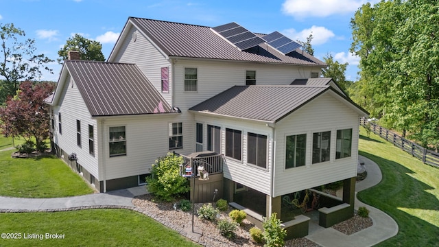 684 Cheslon Rd, Munfordville, KY 42765 - rear view of house with metal roof and a chimney