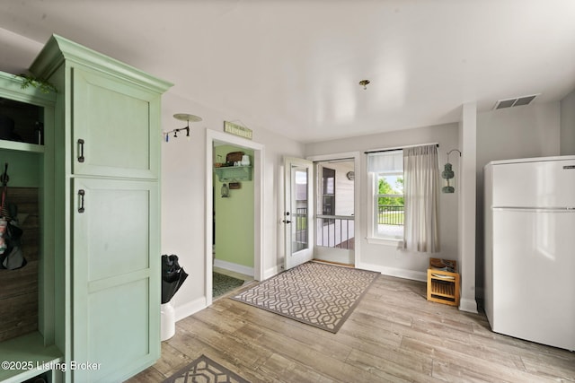 684 Cheslon Rd, Munfordville, KY 42765 - entryway featuring light wood-style flooring, baseboards, and french doors