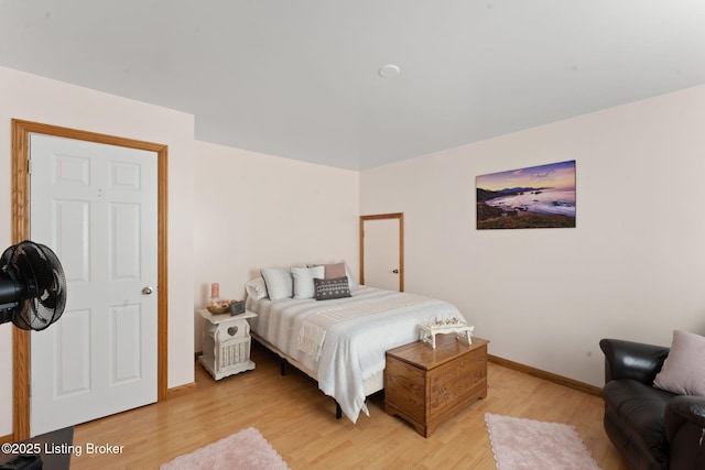 684 Cheslon Rd, Munfordville, KY 42765 - bedroom with baseboards and light wood-style flooring