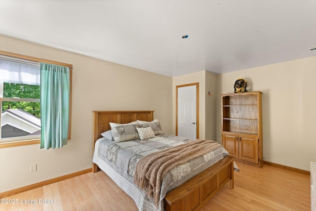 684 Cheslon Rd, Munfordville, KY 42765 - bedroom with light wood-type flooring and baseboards