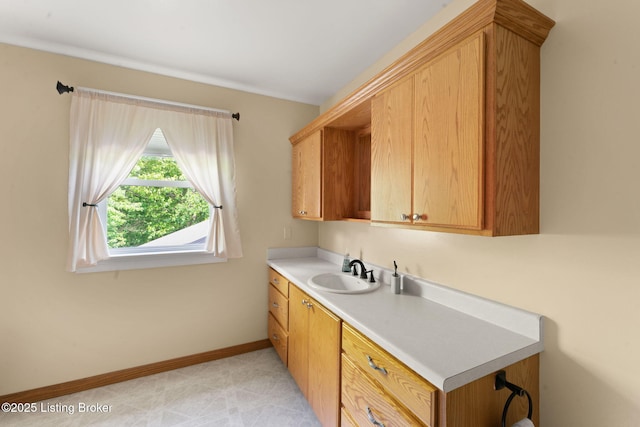 684 Cheslon Rd, Munfordville, KY 42765 - kitchen with a sink, light countertops, and baseboards