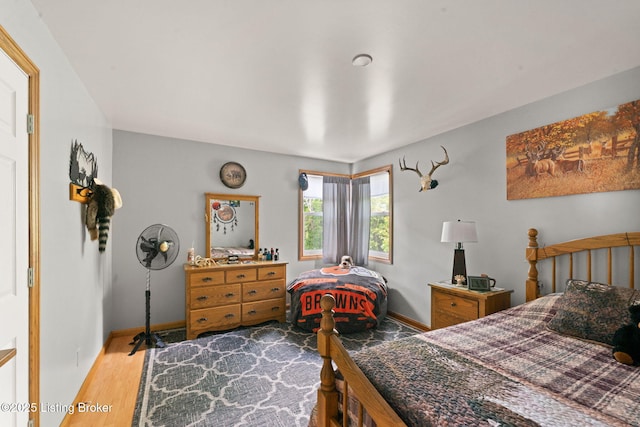 684 Cheslon Rd, Munfordville, KY 42765 - bedroom featuring wood finished floors and baseboards
