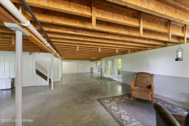 684 Cheslon Rd, Munfordville, KY 42765 - below grade area featuring stairway and concrete block wall