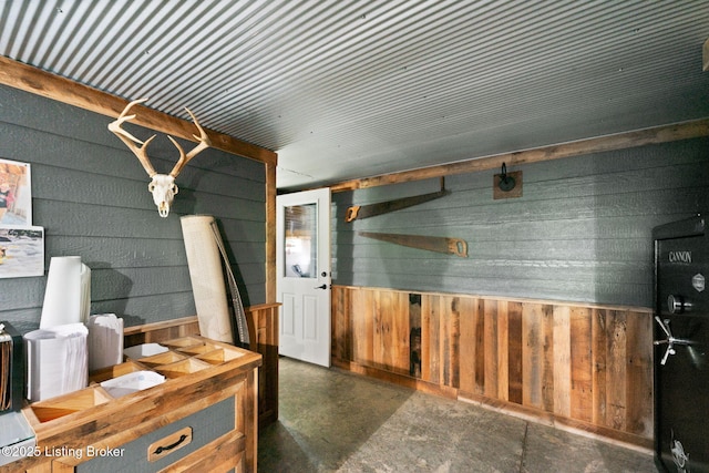 684 Cheslon Rd, Munfordville, KY 42765 - misc room featuring wood walls and finished concrete flooring