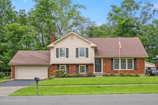 9707 Gateway Dr, Louisville, KY 40299 - tri-level home with brick siding and an attached garage