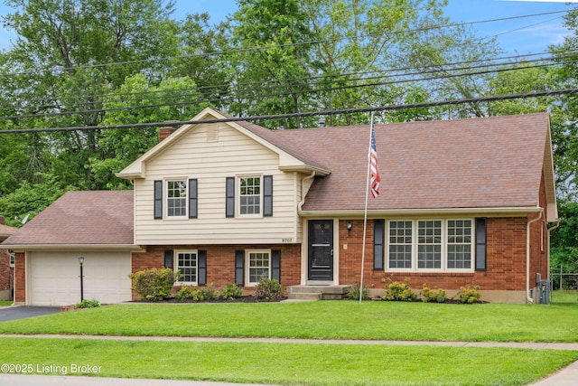 9707 Gateway Dr, Louisville, KY 40299 - tri-level home featuring a garage, driveway, brick siding, a chimney, and a shingled roof