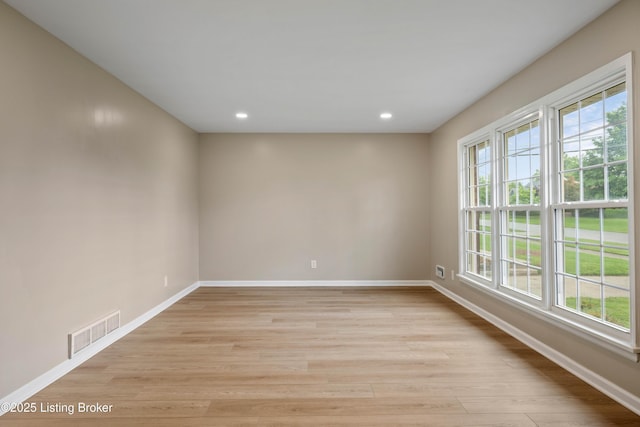 9707 Gateway Dr, Louisville, KY 40299 - empty room with plenty of natural light, baseboards, light wood finished floors, and recessed lighting