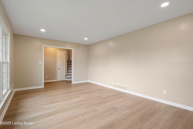9707 Gateway Dr, Louisville, KY 40299 - spare room featuring stairs, light wood finished floors, baseboards, and recessed lighting