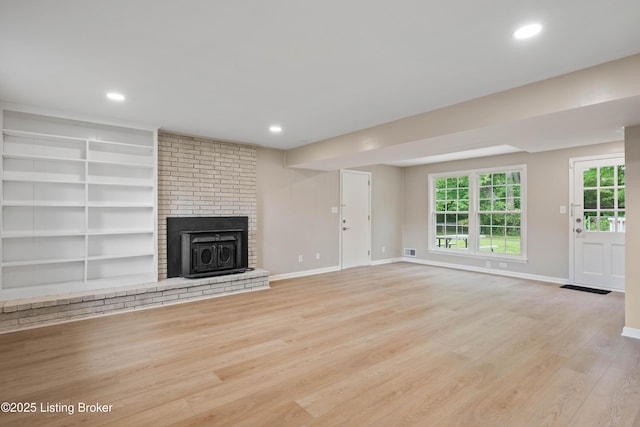 9707 Gateway Dr, Louisville, KY 40299 - unfurnished living room with wood finished floors, a brick fireplace, baseboards, recessed lighting, and healthy amount of natural light