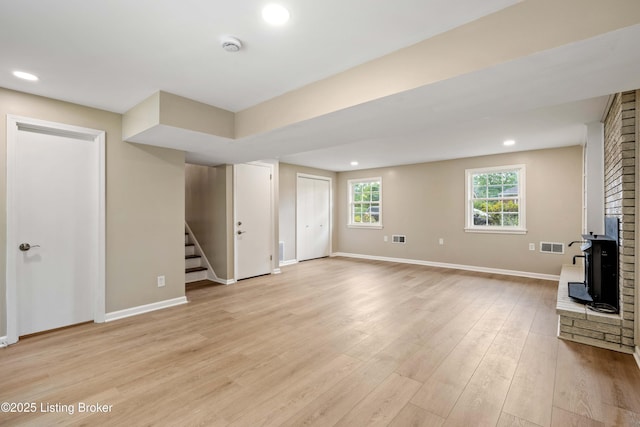 9707 Gateway Dr, Louisville, KY 40299 - unfurnished living room with stairs, baseboards, light wood finished floors, and recessed lighting