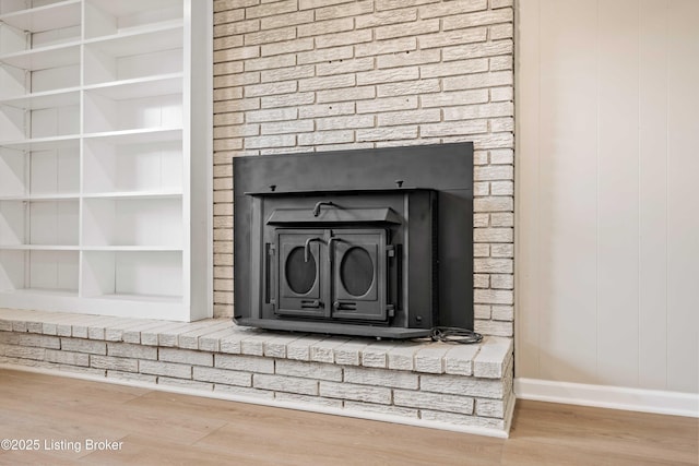 9707 Gateway Dr, Louisville, KY 40299 - detailed view of wood finished floors, baseboards, and a fireplace