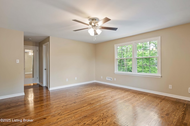 9707 Gateway Dr, Louisville, KY 40299 - spare room featuring ceiling fan, wood finished floors, and baseboards