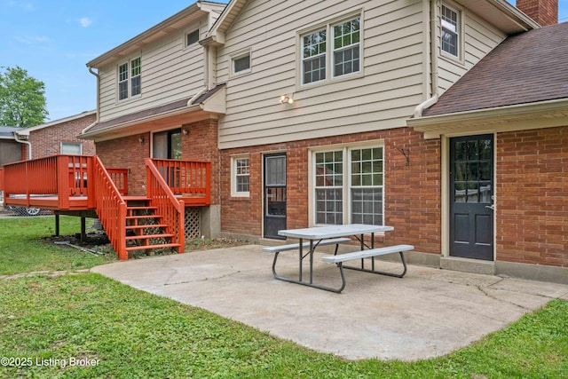 9707 Gateway Dr, Louisville, KY 40299 - back of property with a patio, a wooden deck, a yard, and brick siding