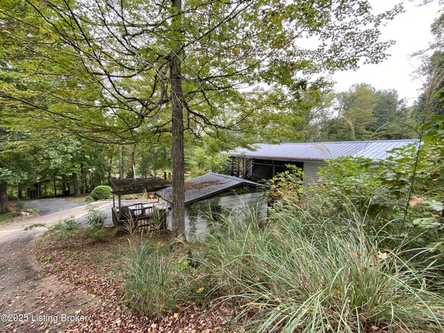 682 Hornback Mill Ln, Leitchfield, KY 42754 - view of home's exterior featuring metal roof