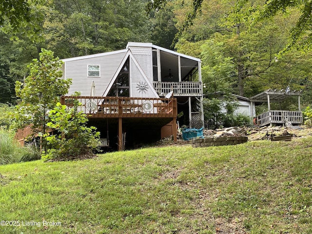 682 Hornback Mill Ln, Leitchfield, KY 42754 - rear view of property featuring a wooden deck, a view of trees, a lawn, and a pergola