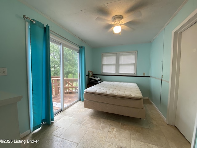 682 Hornback Mill Ln, Leitchfield, KY 42754 - bedroom featuring access to exterior, stone tile floors, ornamental molding, baseboards, and ceiling fan