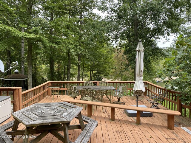 682 Hornback Mill Ln, Leitchfield, KY 42754 - wooden terrace with outdoor dining space and view of wooded area