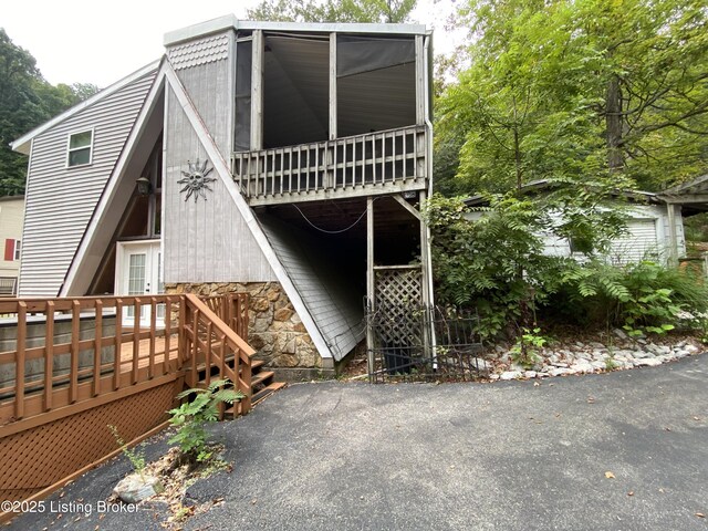 682 Hornback Mill Ln, Leitchfield, KY 42754 - view of front of house with a deck and stone siding