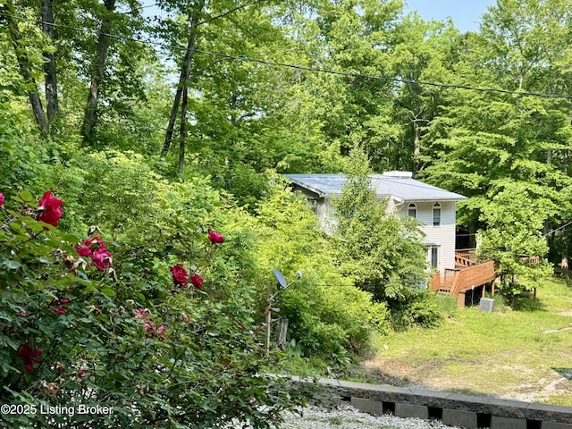 682 Hornback Mill Ln, Leitchfield, KY 42754 - view of yard featuring a forest view and a deck
